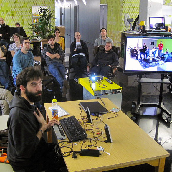 René Jaun from access-for-all.ch talking about accessibility at the Liip Zurich office with Liip Fribourg participating via videoconferencing setup